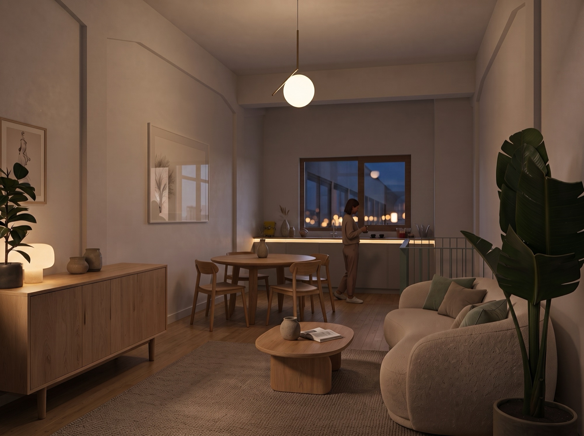 The same living floor in evening light, with the lamp above the dining table on